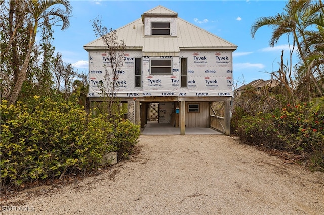 view of front of home with a carport