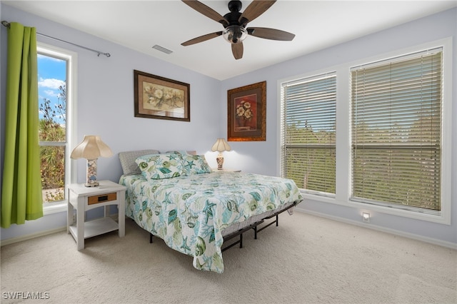 carpeted bedroom with ceiling fan