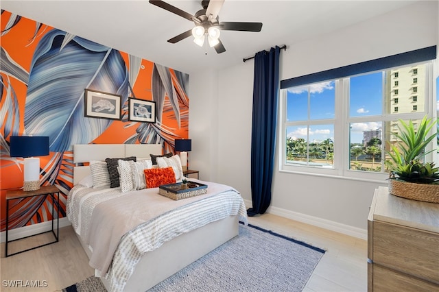 bedroom featuring ceiling fan and light wood-type flooring