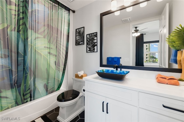 full bathroom featuring ceiling fan, tile patterned floors, toilet, shower / tub combo with curtain, and vanity