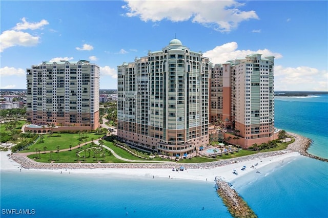 exterior space featuring a water view and a view of the beach