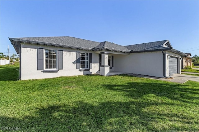 single story home featuring a front yard and a garage