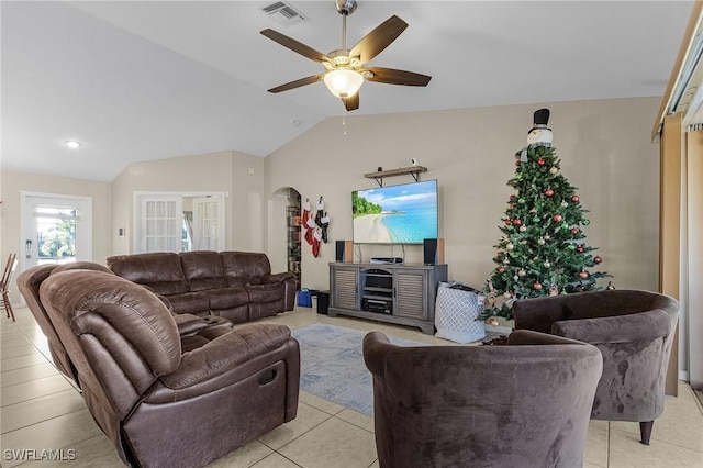 tiled living room with ceiling fan and lofted ceiling