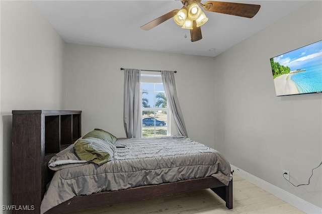 bedroom featuring ceiling fan and light hardwood / wood-style floors