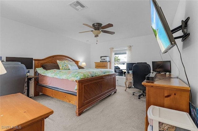 bedroom with ceiling fan and light carpet