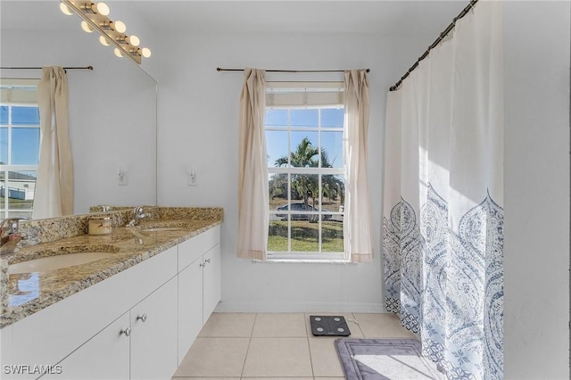 bathroom featuring tile patterned flooring and vanity