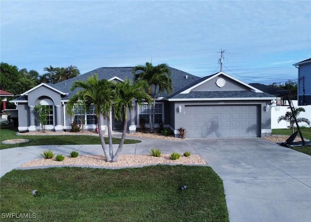 ranch-style house with a garage and a front yard