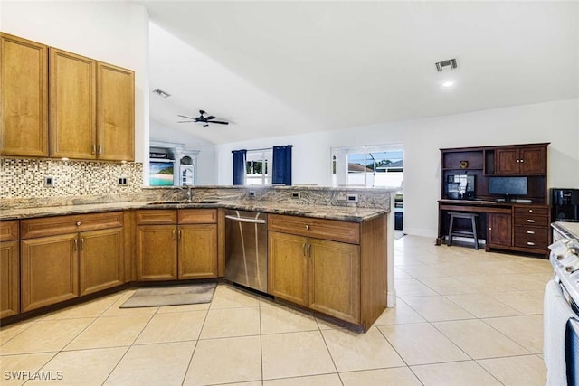 kitchen featuring dishwasher, stone counters, vaulted ceiling, ceiling fan, and kitchen peninsula