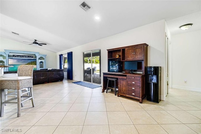 living room featuring ceiling fan, lofted ceiling, and light tile patterned flooring