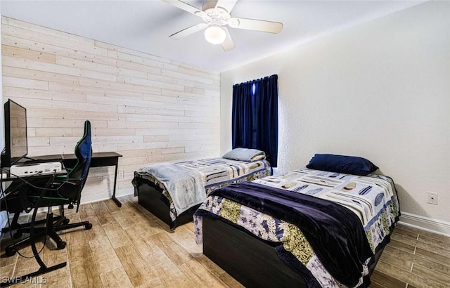 bedroom featuring hardwood / wood-style flooring and ceiling fan