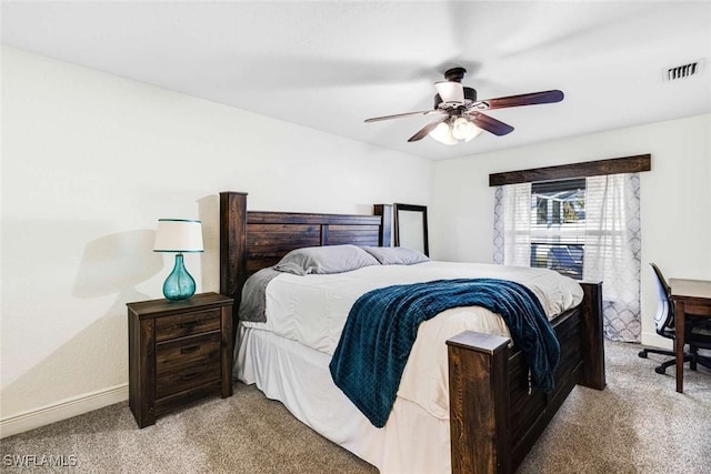 bedroom featuring ceiling fan and light carpet