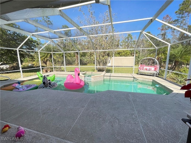 view of pool featuring a lanai, a patio area, and an in ground hot tub