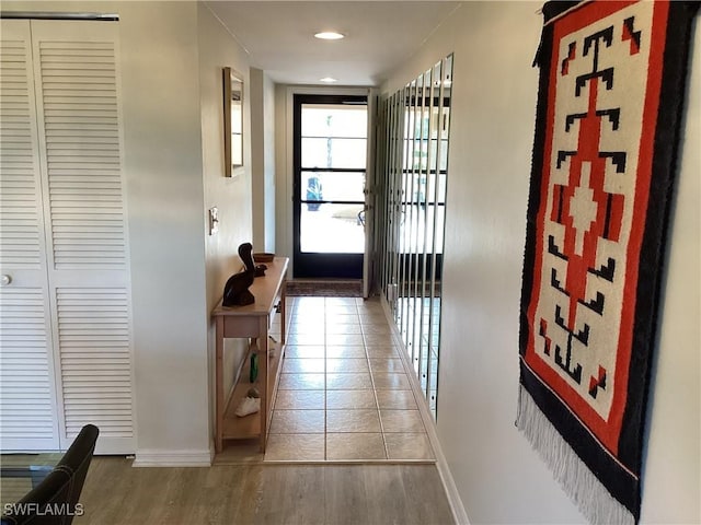 corridor featuring wood-type flooring