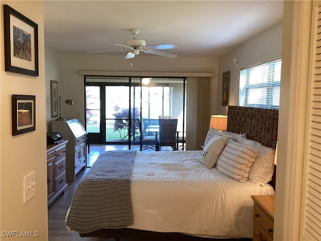 bedroom featuring ceiling fan, dark hardwood / wood-style floors, and access to exterior