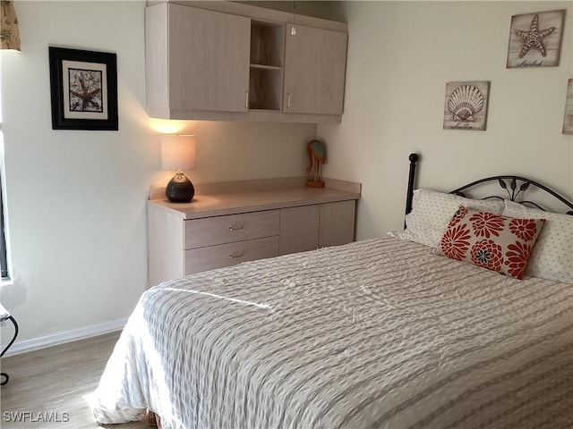 bedroom with light hardwood / wood-style floors