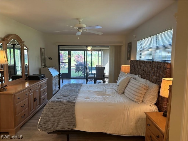 bedroom featuring ceiling fan, light wood-type flooring, and access to outside