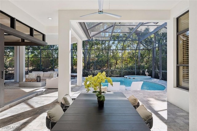 exterior space featuring ceiling fan, plenty of natural light, and a pool