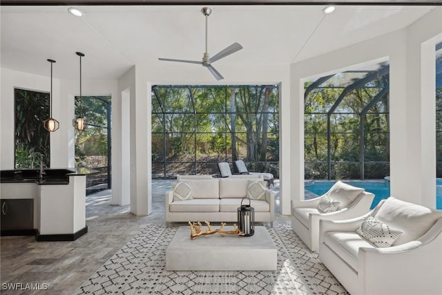 sunroom / solarium with ceiling fan