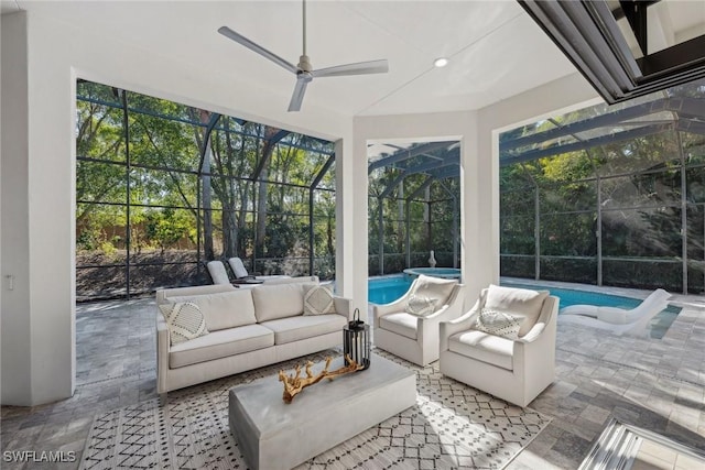 sunroom / solarium featuring a wealth of natural light and ceiling fan