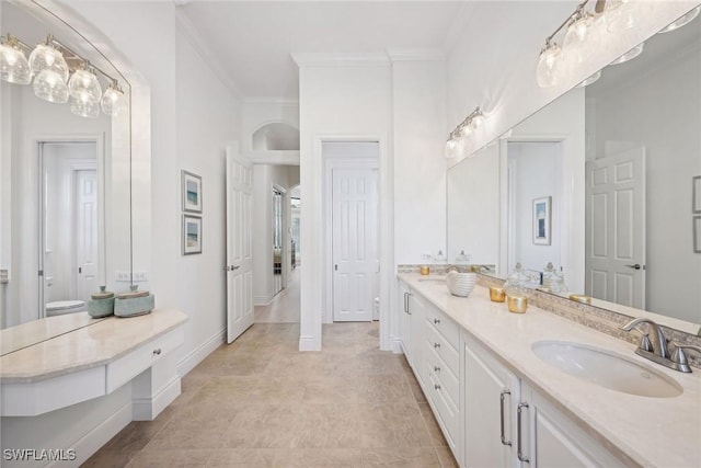 bathroom with vanity and crown molding