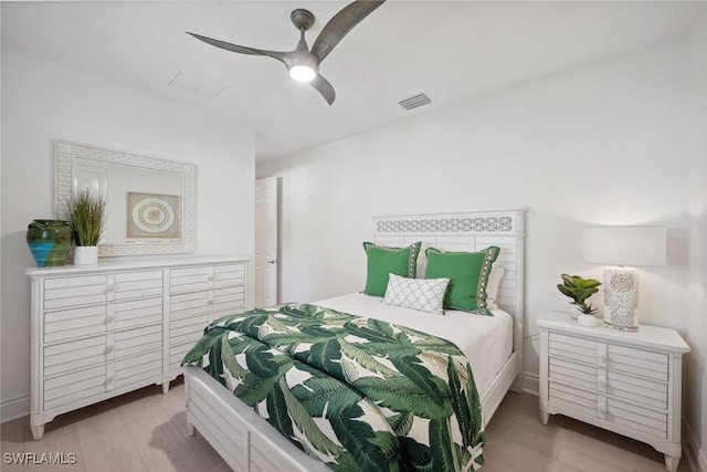 bedroom with ceiling fan and light wood-type flooring