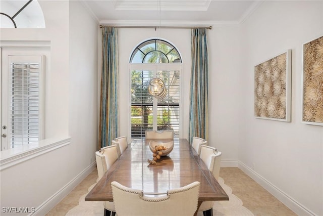 dining room featuring crown molding and light tile patterned flooring