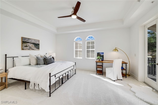 carpeted bedroom featuring access to outside, a raised ceiling, ceiling fan, and crown molding