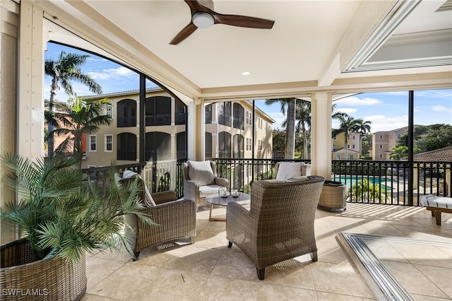 sunroom with ceiling fan