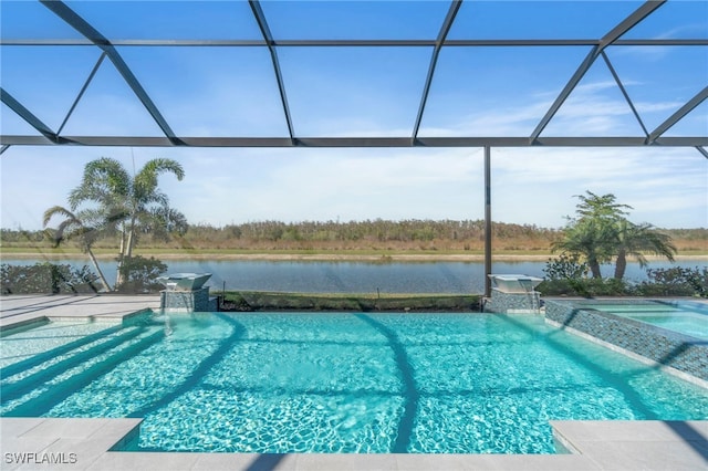 view of pool with a lanai, pool water feature, and a water view