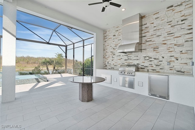 view of patio with a lanai, ceiling fan, a sink, and area for grilling