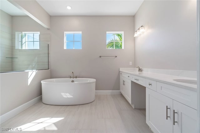 bathroom with plus walk in shower and vanity