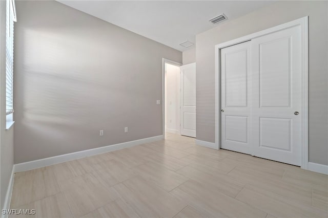 unfurnished bedroom featuring a closet