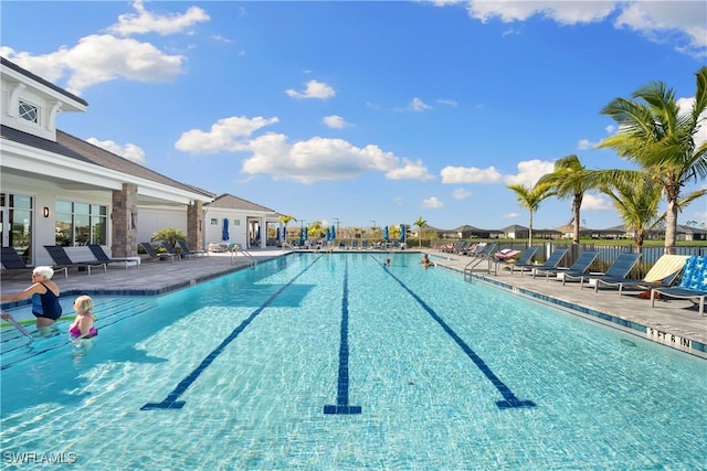 view of swimming pool featuring a patio area