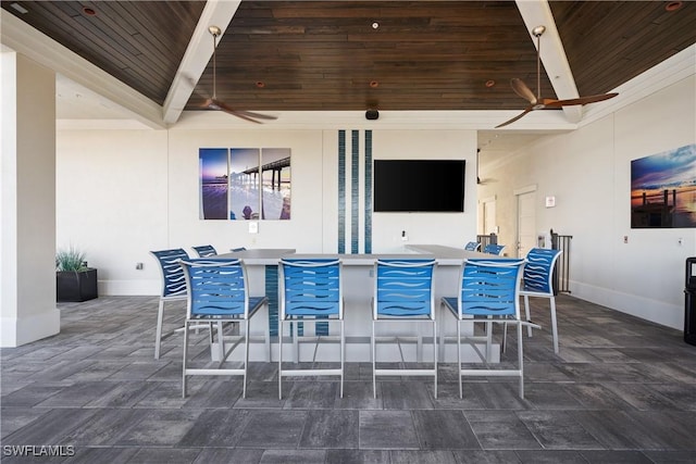 view of patio with outdoor dining space and a ceiling fan