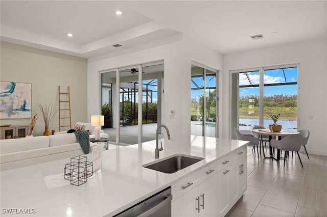 kitchen with recessed lighting, a healthy amount of sunlight, visible vents, and a sink