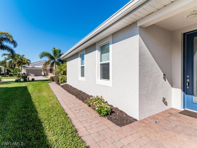 view of property exterior featuring a yard