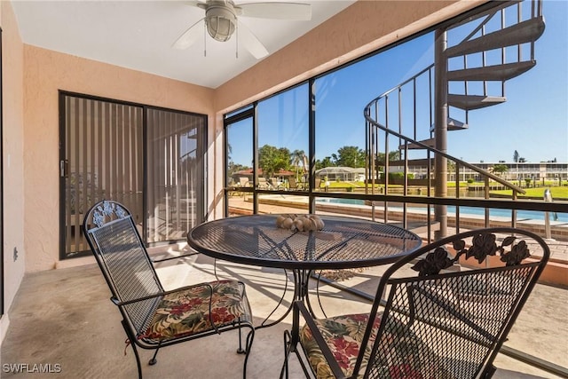 sunroom / solarium with ceiling fan