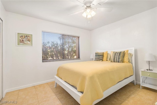 bedroom featuring ceiling fan and light tile patterned flooring