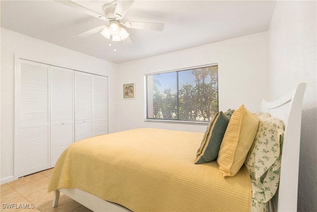 tiled bedroom featuring a closet and ceiling fan