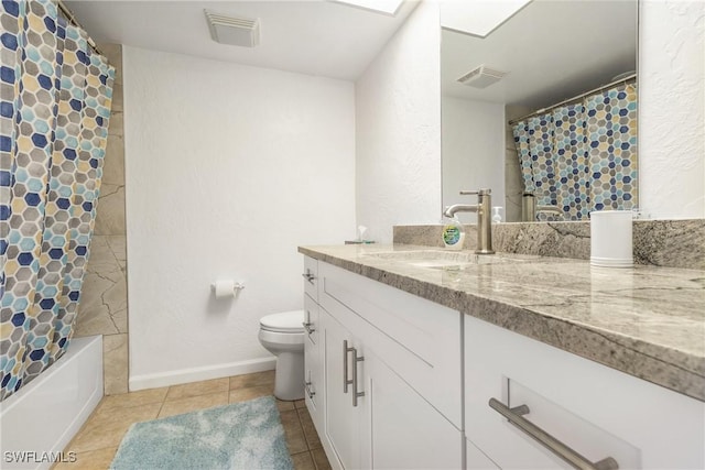 full bathroom featuring tile patterned flooring, shower / bath combination with curtain, vanity, and toilet