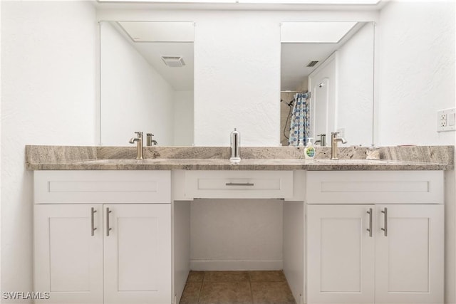 bathroom with tile patterned floors, vanity, and a shower with curtain