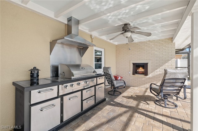 view of patio with a grill and ceiling fan