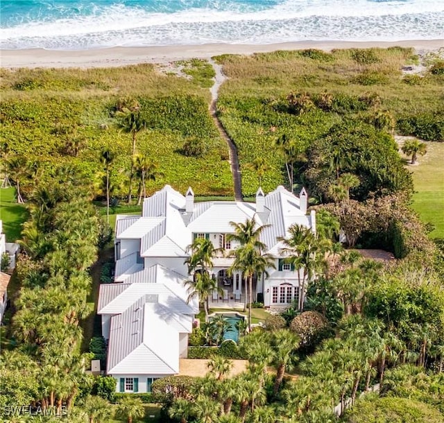 aerial view featuring a water view and a beach view