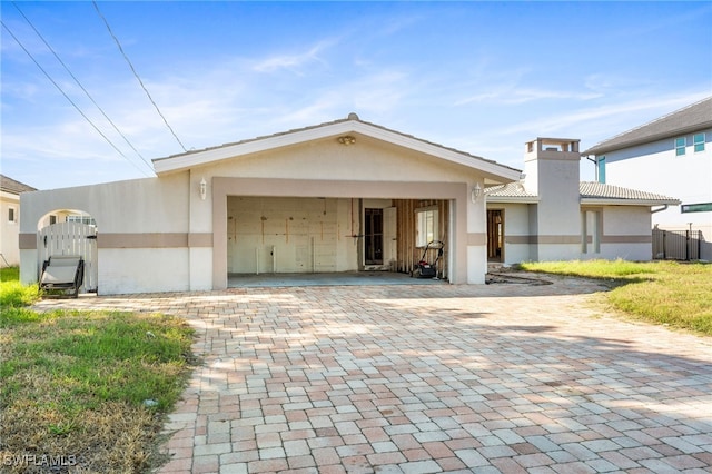 view of front of home featuring a carport