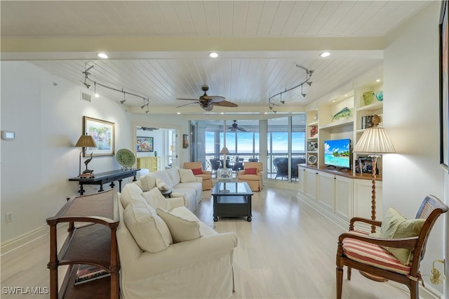 living room with track lighting, light hardwood / wood-style flooring, and wood ceiling