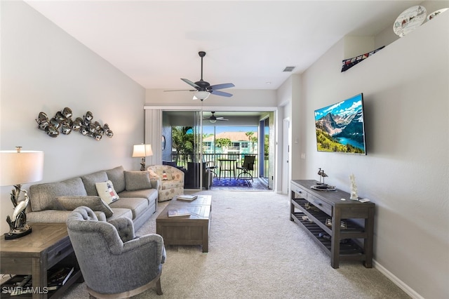 carpeted living room featuring ceiling fan