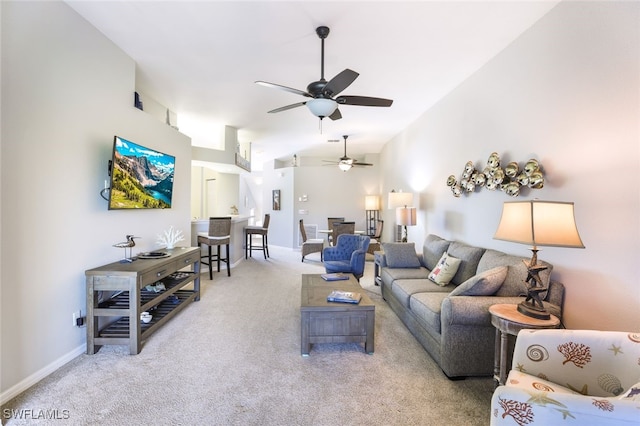 carpeted living room featuring ceiling fan and lofted ceiling