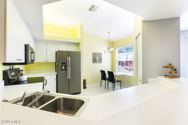 kitchen featuring an inviting chandelier, sink, appliances with stainless steel finishes, decorative light fixtures, and white cabinetry