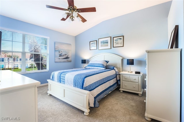 bedroom featuring light carpet, vaulted ceiling, and ceiling fan