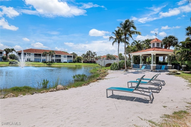 view of home's community with a gazebo and a water view